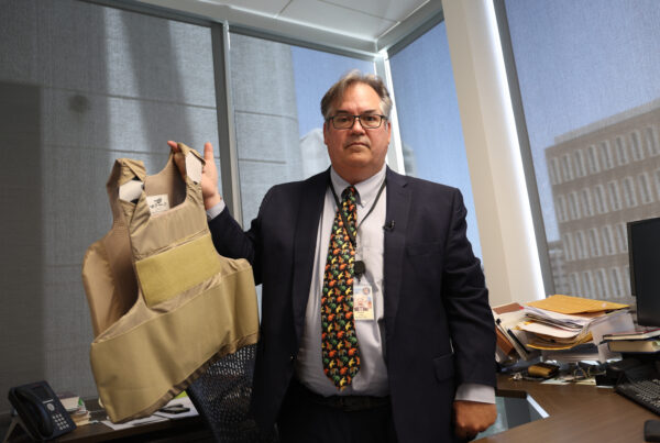 Tom Liddy, a lifelong Republican who heads the civil division at the Maricopa County Attorney’s Office, shows the bulletproof vest the FBI told him to wear after he and his family were threatened. (Photo by Denzen Cortez/News21)