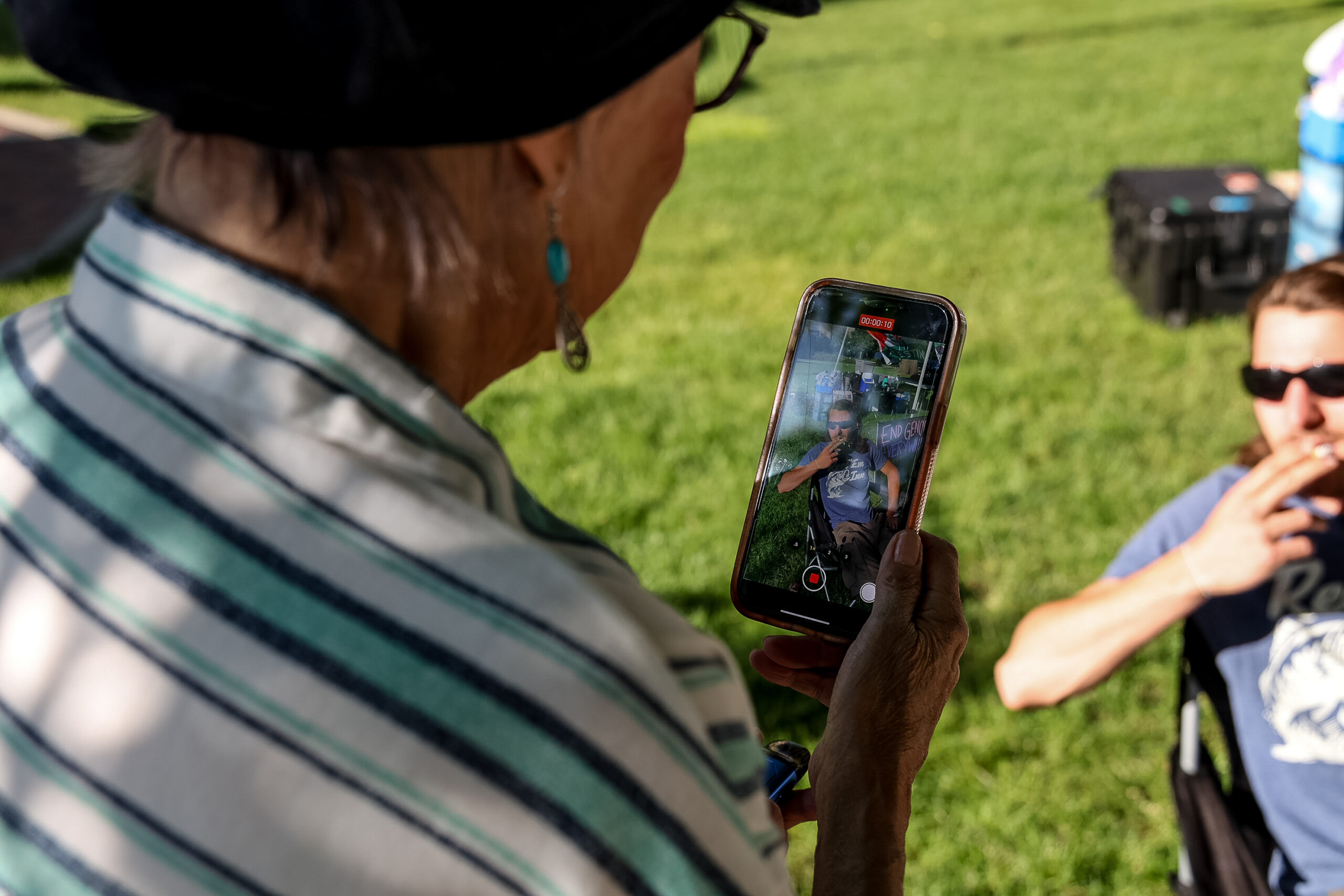 Pamela Hemphill interviews Micah McDonald at a pro-Palestinian demonstration in Boise, Idaho, on June 16, 2024. (Photo by Donovan Johnson/News21)