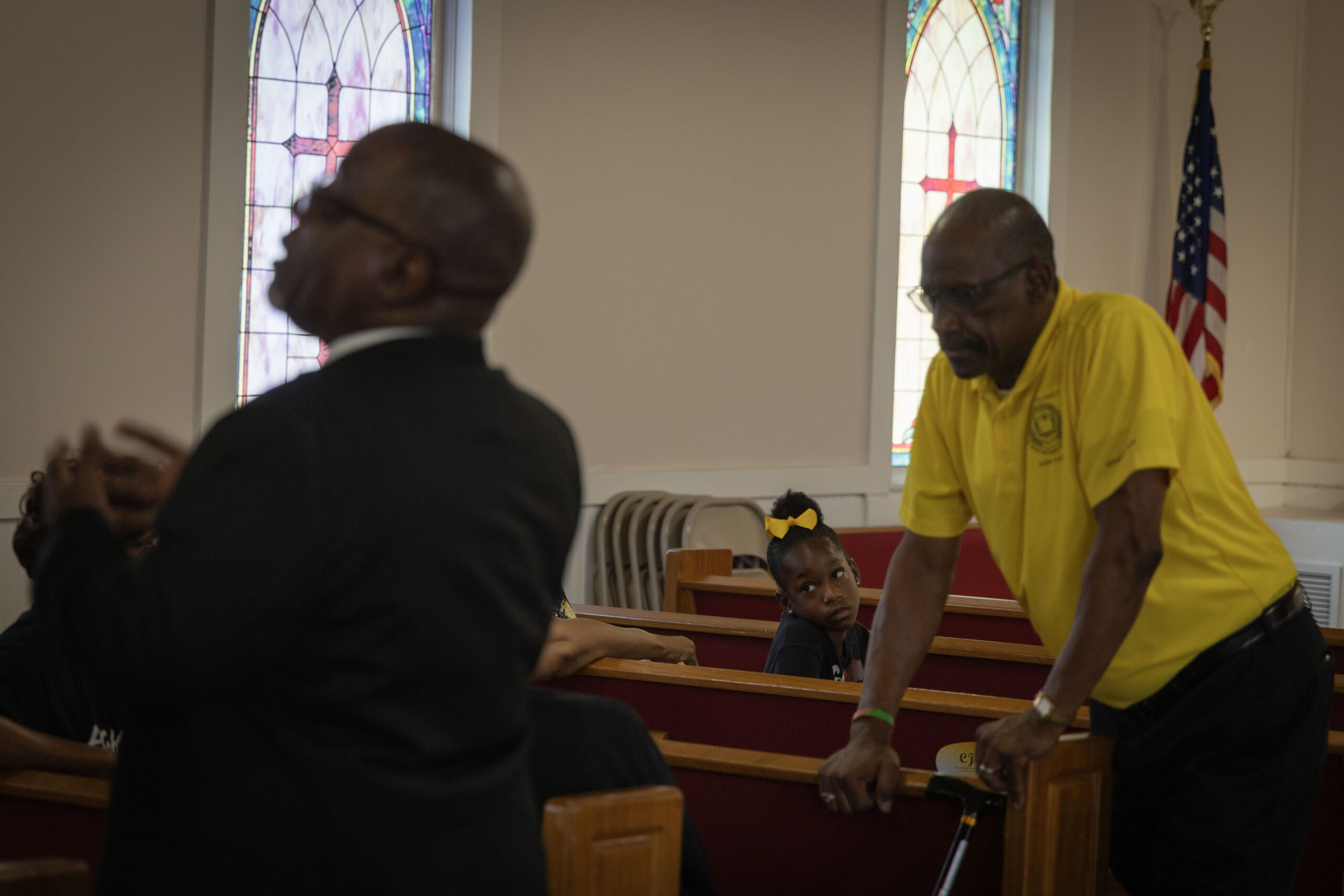 Attendees gather around the pews of New Bayside Baptist Church before a voter participation event in Mobile, Ala., June 15, 2024. (Photo by Jordan Moore/News21)