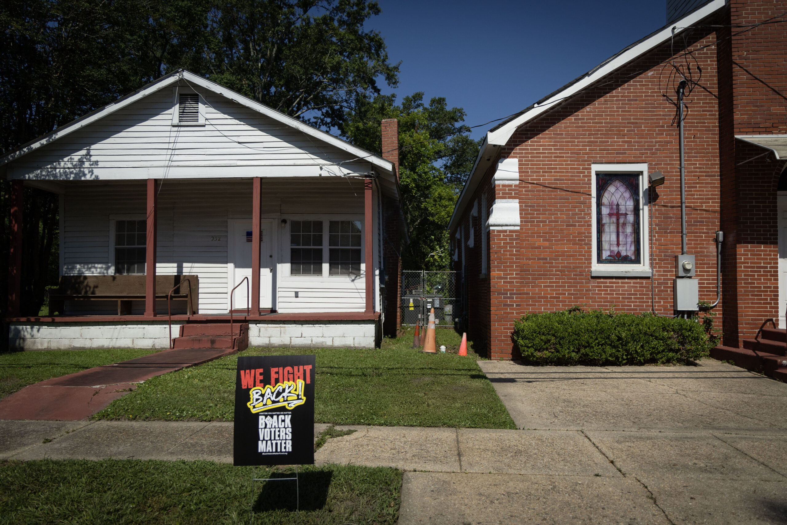 A “We Fight Back! Black Voters Matter” sign sits in front of a home next to the New Bayside Baptist Church in Mobile, Ala., on June 15, 2024. (Photo by Jordan Moore/News21)