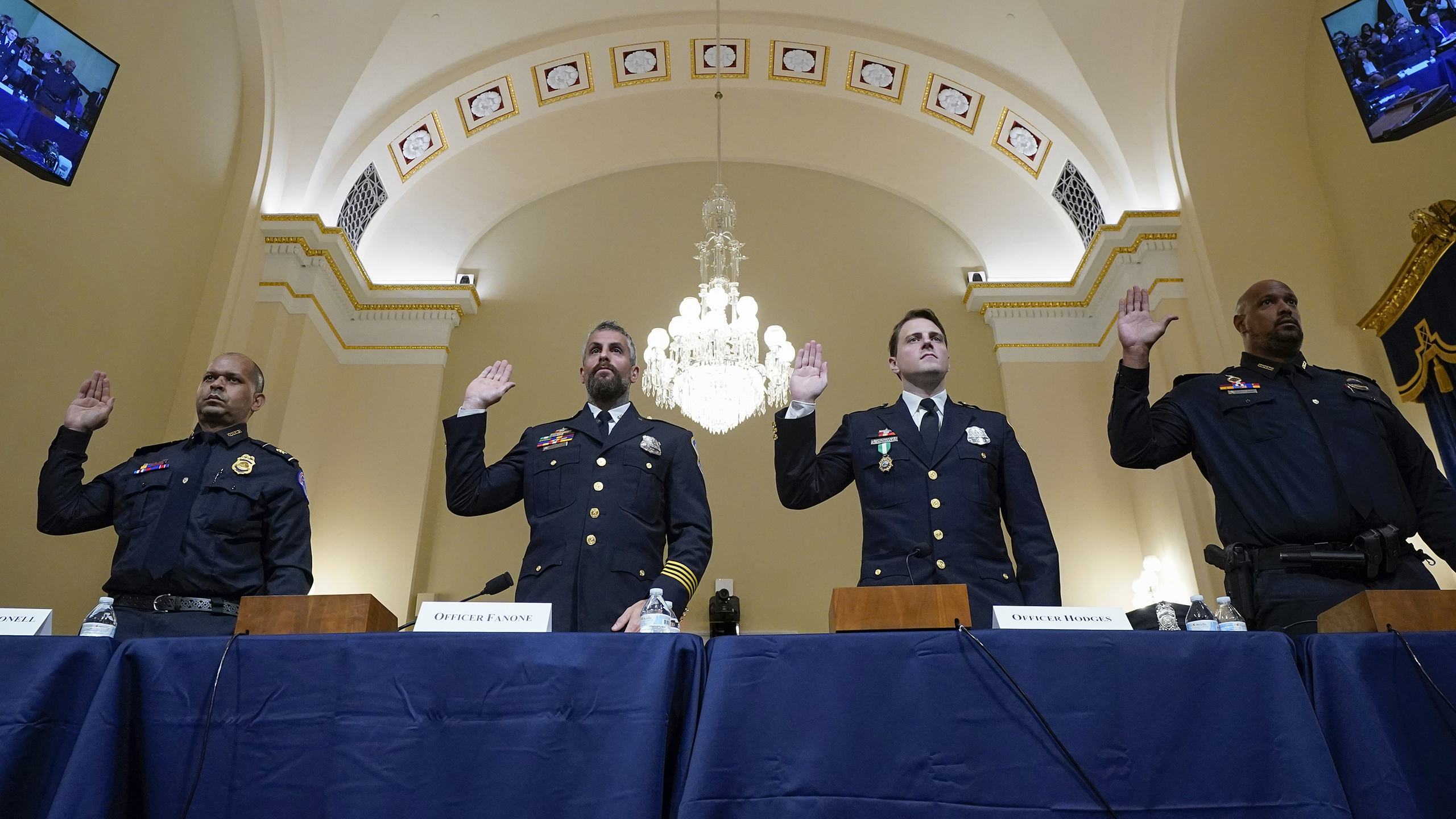 Aquilino Gonell, far left, and Daniel Hodges, third from the left, testify with two other police officers before the House committee that investigated the Capitol insurrection. (Photo by Andrew Harnik-Pool/Getty Images)